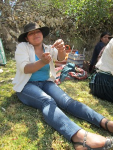 Making Earrings at Ruraq Maki's Workshop Before Addressing the Women in Huancarani